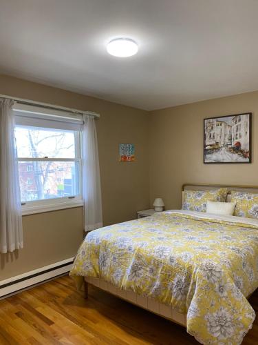 a bedroom with a bed and a window at Downtown Halifax near waterfront in Halifax
