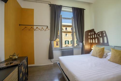 a bedroom with a large bed and a window at Rooftop St. Peter in Rome