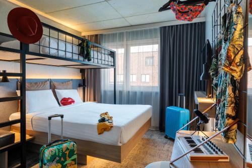 a bedroom with a bunk bed with a teddy bear sitting on it at Moxy Hamburg Altona in Hamburg