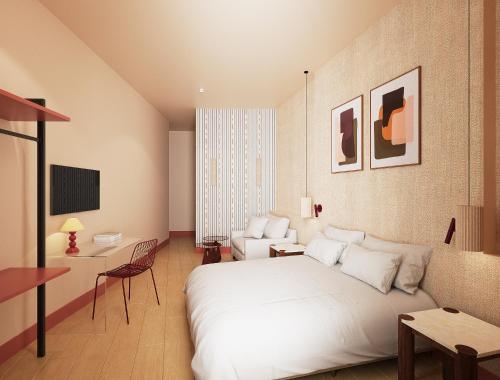 a bedroom with a large white bed and a couch at BYPILLOW Naranjo in Seville