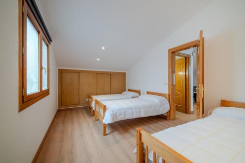 a bedroom with two beds and a window at Luxury Getaway in Girona in Riudellots de la Selva
