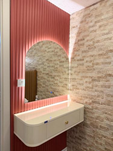 a bathroom with a sink and a mirror at elisa apart 3 in Istanbul