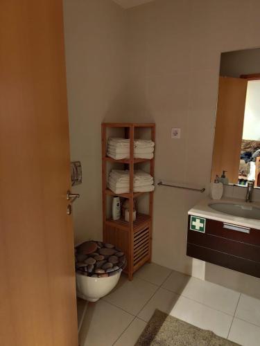 a bathroom with a toilet and a sink at Pacos Beach House in Lavra