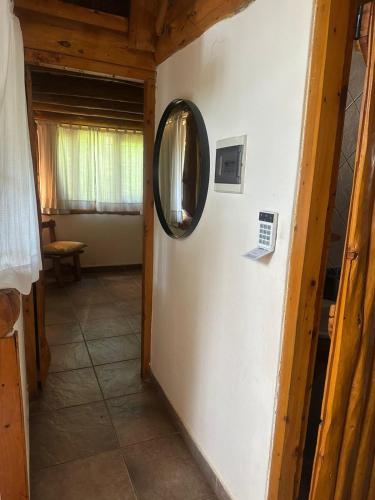 a mirror on a wall in a room at Casa cuidamos in Mar de las Pampas