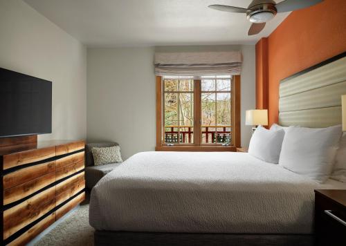 a hotel room with a bed and a window at The Residences at Main Street Station by Hyatt Vacation Club in Breckenridge