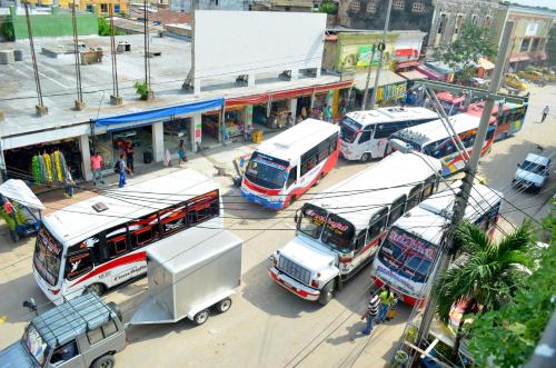 a group of buses parked at a bus station at Hotel San Marcos Barranquilla in Barranquilla