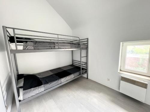 a room with a bunk bed with a window at Robert 20 Brussels-charleroi-airport in Charleroi
