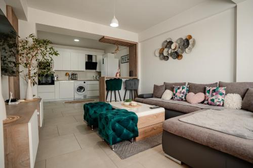 a living room with a couch and a table at Ohrid Pearl Apartment in Ohrid