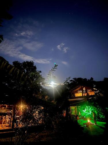 a person standing on a skate park at night at Tudo é Arte Retreat - A Creative Haven Between Nature and Sea in Piçarras