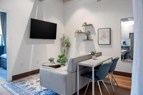 a living room with a couch and a table at Cute Little Condo no 310 in Dallas