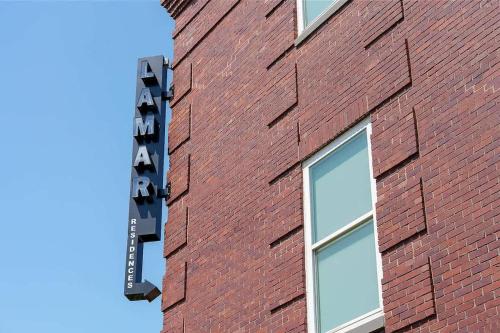 a brick building with a sign on the side of it at Cute Little Condo no 310 in Dallas