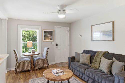 a living room with a couch and a table at Pasture Bedtime in Franklin