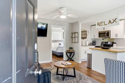 a kitchen and a living room with a table at Pasture Bedtime in Franklin
