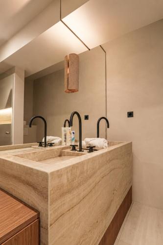 a bathroom with two sinks and a large mirror at Casa Liana Saint-Tropez in Saint-Tropez