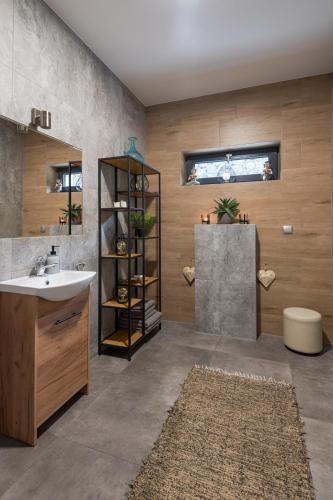 a bathroom with a sink and a shower and a sink at Dom Przebudzeń in Porąbka