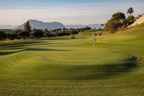 a view of a golf course with a green at La Finca Resort in Algorfa
