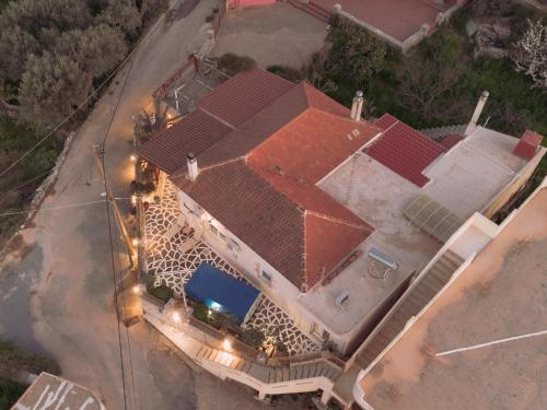 an overhead view of a large house with a swimming pool at The Morus House with Private pool in Melidhónion