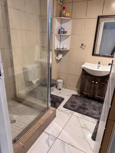 a bathroom with a shower and a sink at Luxe spot in Johannesburg