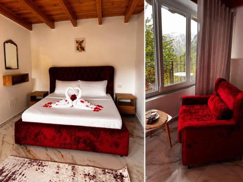 a bedroom with a bed and a red chair at Thethi Paradise Hotel & Restaurant in Theth