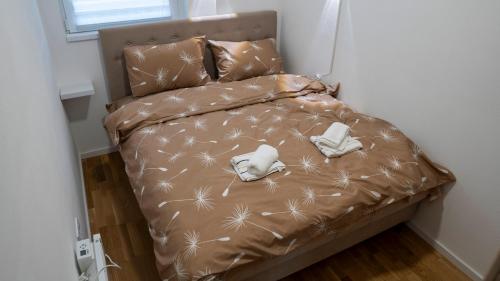a bed with stuffed animals on it in a room at Apartman M&Ð Foca-free parking garage in Foča