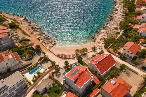 Beachfront Villa Sevid with heated pool and jacuzzi