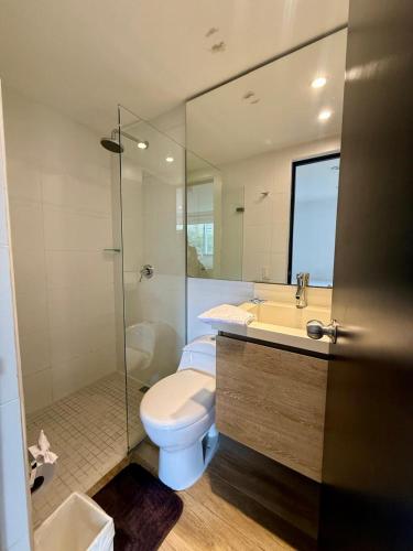 a bathroom with a toilet and a sink and a shower at Beautiful Apto in Poblado in Medellín
