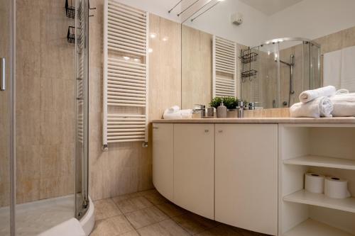 a bathroom with a shower and a sink at Leoncino Apartment in Verona