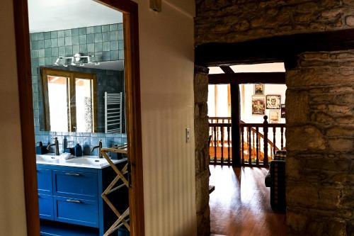 a kitchen with a sink and a counter top at Gîte à l'origine in Montgesoye