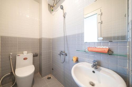 a bathroom with a toilet and a sink at Villa Tuan Vu Da Lat in Da Lat