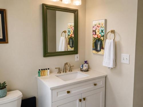 a bathroom with a sink and a mirror at Mt Shasta Basecamp in Dunsmuir