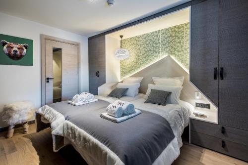 Ένα ή περισσότερα κρεβάτια σε δωμάτιο στο Chalet Skadi - Village Montana