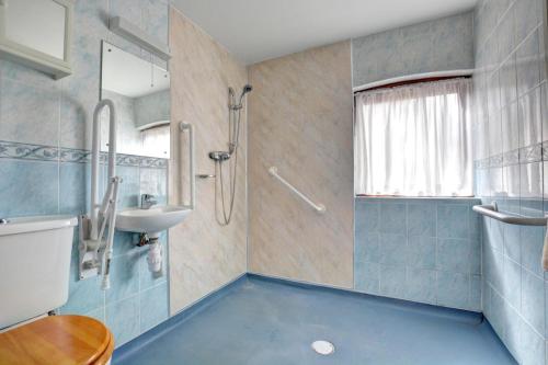 a bathroom with a sink and a shower at 2 Bed in Lyng oc-864 in Lyng