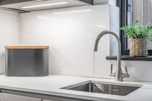 a kitchen with a sink and a faucet at 3 Bed in Looe oc-j29456 in Looe