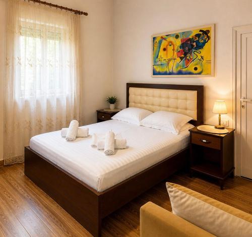 En eller flere senge i et værelse på Hotel Vila C plus plus