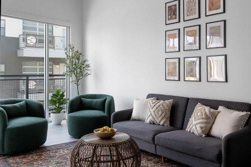 a living room with a couch and two chairs and a table at South Downtown Condo no.308 in Dallas