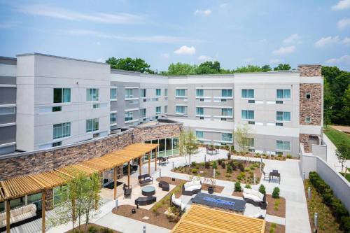 an aerial view of a building with a courtyard at Courtyard by Marriott Wayne Fairfield in Wayne