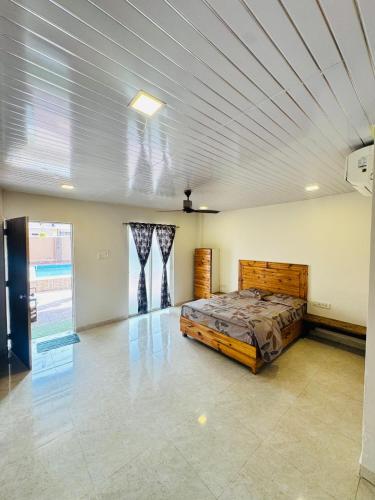 a bedroom with a bed in a room at Baba s Villa in Lonavala
