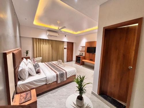 a hotel room with a bed and a bathroom at Vantara Gir Resort in Sasan Gir