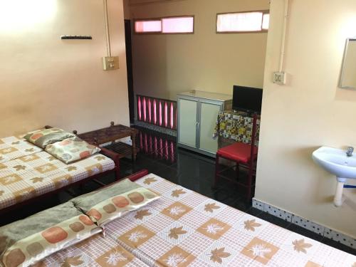 Postel nebo postele na pokoji v ubytování Pleasant Inn