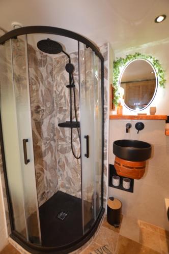 a shower in a bathroom with a sink at Villa rundinella in Vero