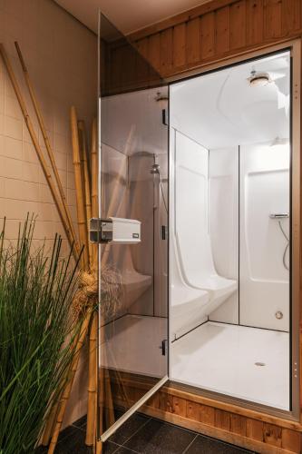 a glass shower stall in a room with at Hotel Marques De Pombal in Lisbon