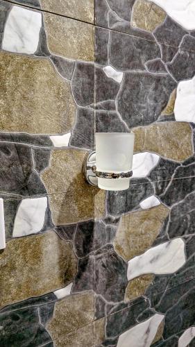 a candle on top of a stone wall at 7G Residency Bwejuu in Bwejuu