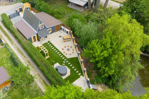 an overhead view of a blue house with a yard at Chata Björk in Babice