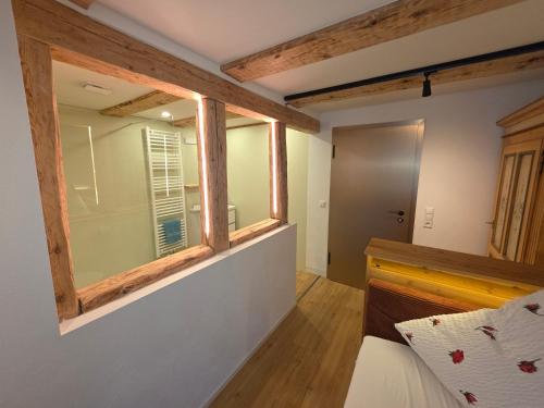 a room with a window and a bed in it at Pension Kaiserhaus in Ühlingen-Birkendorf