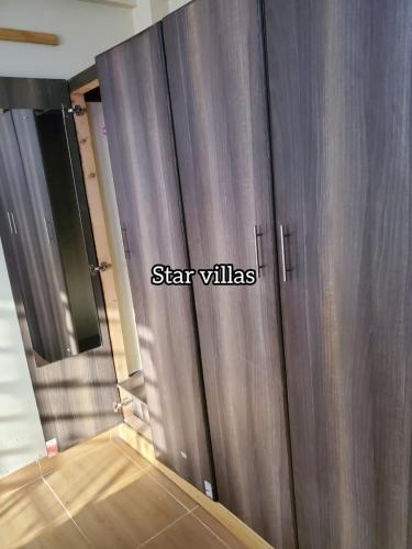 a pair of metal doors with the words star villas on them at Star Villas Nyahururu in Nyahururu