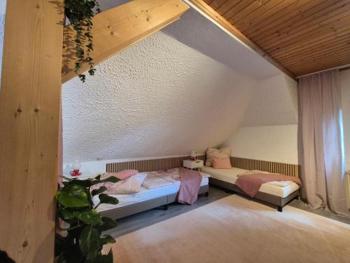 a bedroom with two beds in a room at FeWo im Forsthaus in Marktredwitz
