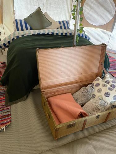 a suitcase sitting on the floor next to a bed at The Spinney, close to Silverstone in Brackley