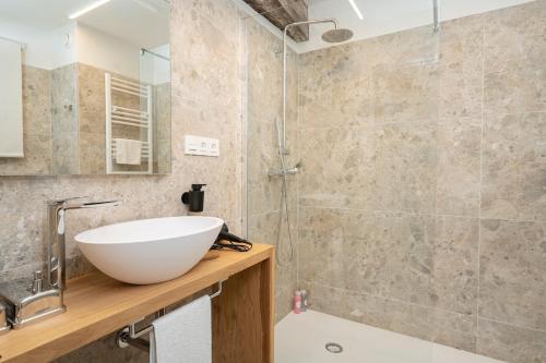 a bathroom with a sink and a shower at Benaki 92B in Ladines