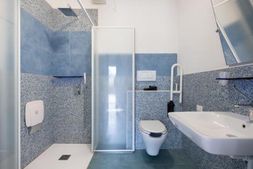 a bathroom with a toilet and a sink at Casa Del Noce in Rovereto