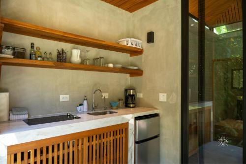 a kitchen with a sink and a counter top at Serenity Bungalow in Cocles